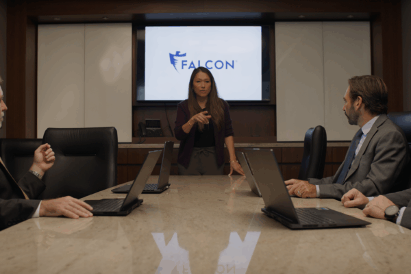 Dr. Elizabeth Falcon speaking to employees in a conference room