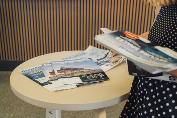 issues of Correctional News magazine on a table