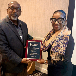 Dr. Michael Satchell of the Georgia Academy of Family Physicians presenting an award to Dr. Walkitria Smith