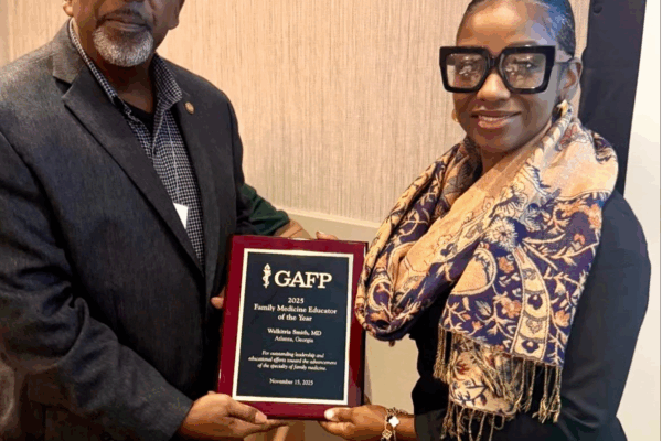 Dr. Michael Satchell of the Georgia Academy of Family Physicians presenting an award to Dr. Walkitria Smith