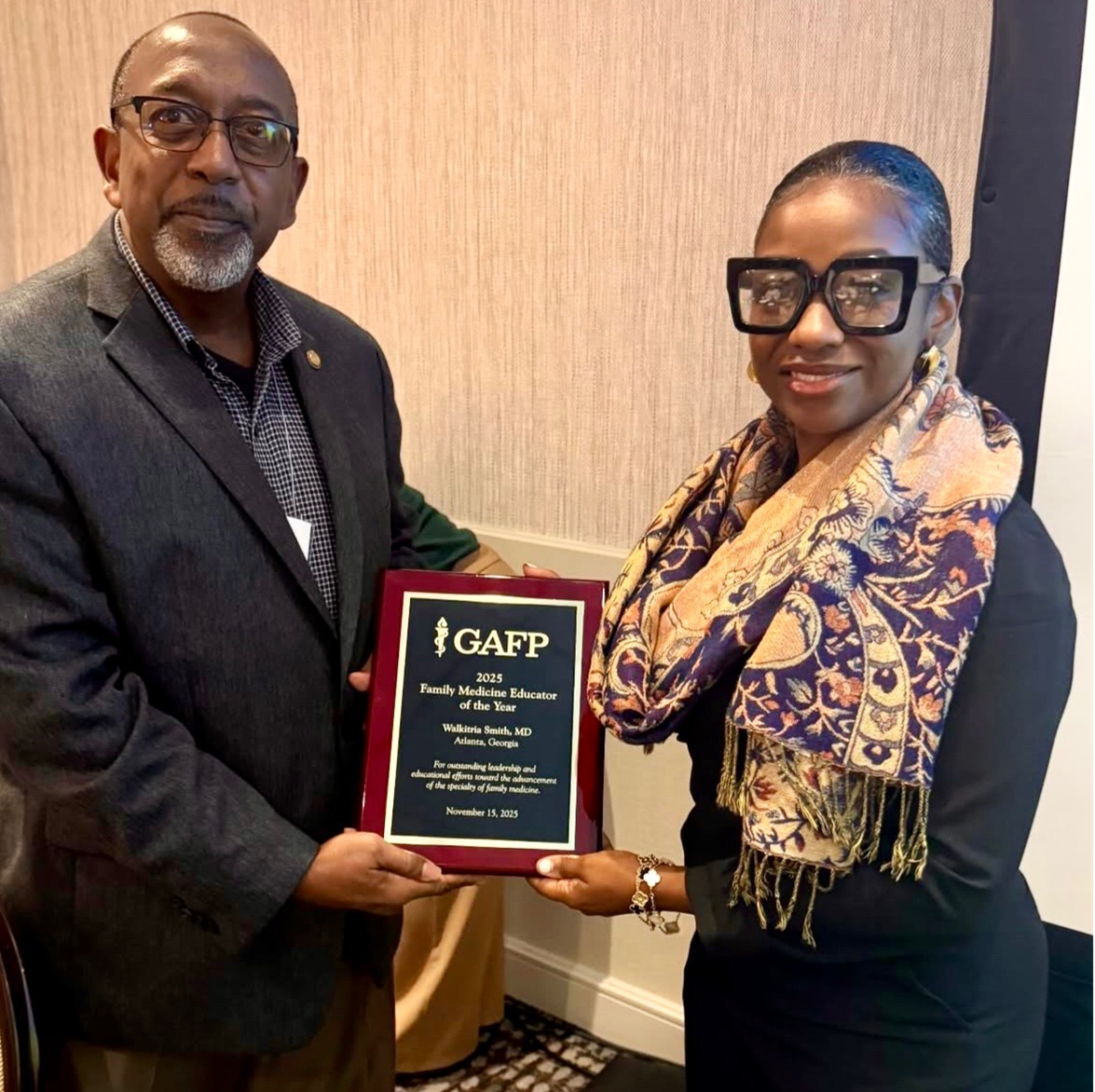 Dr. Michael Satchell of the Georgia Academy of Family Physicians presenting an award to Dr. Walkitria Smith