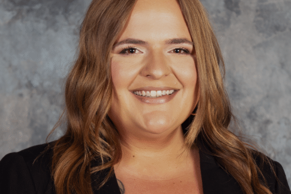headshot photo of Merci Wood with gray background