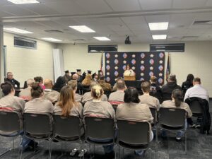 inmates at a sheriff's office graduation ceremony