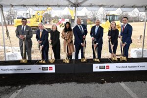 officials at a groundbreaking ceremony with shovels in hand
