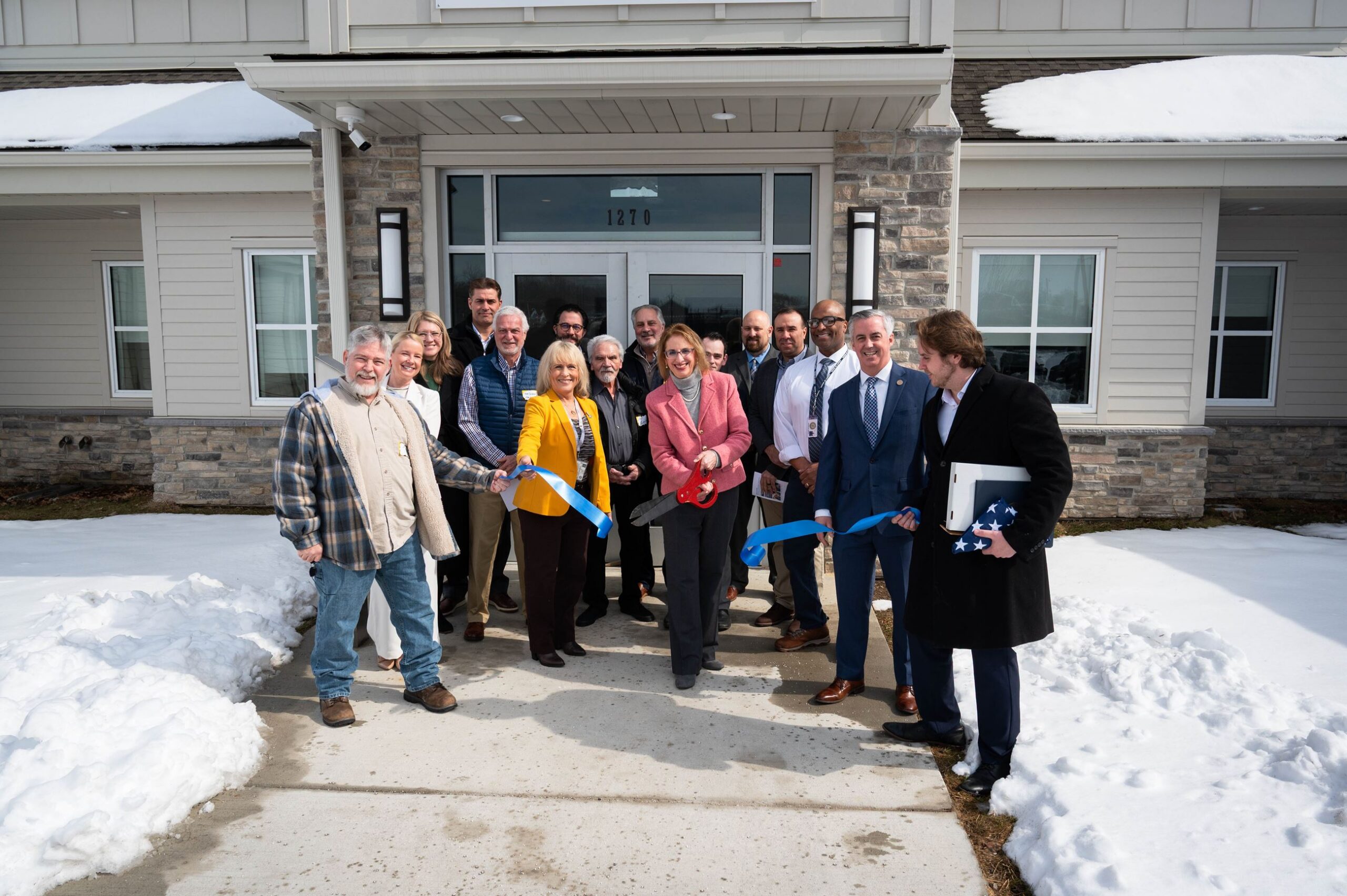 group of people cutting the ribbon at the DART Center in Bucks County, Pa.