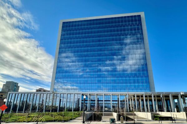 new glass high-rise Sacramento Superior Courthouse building with blue sky background