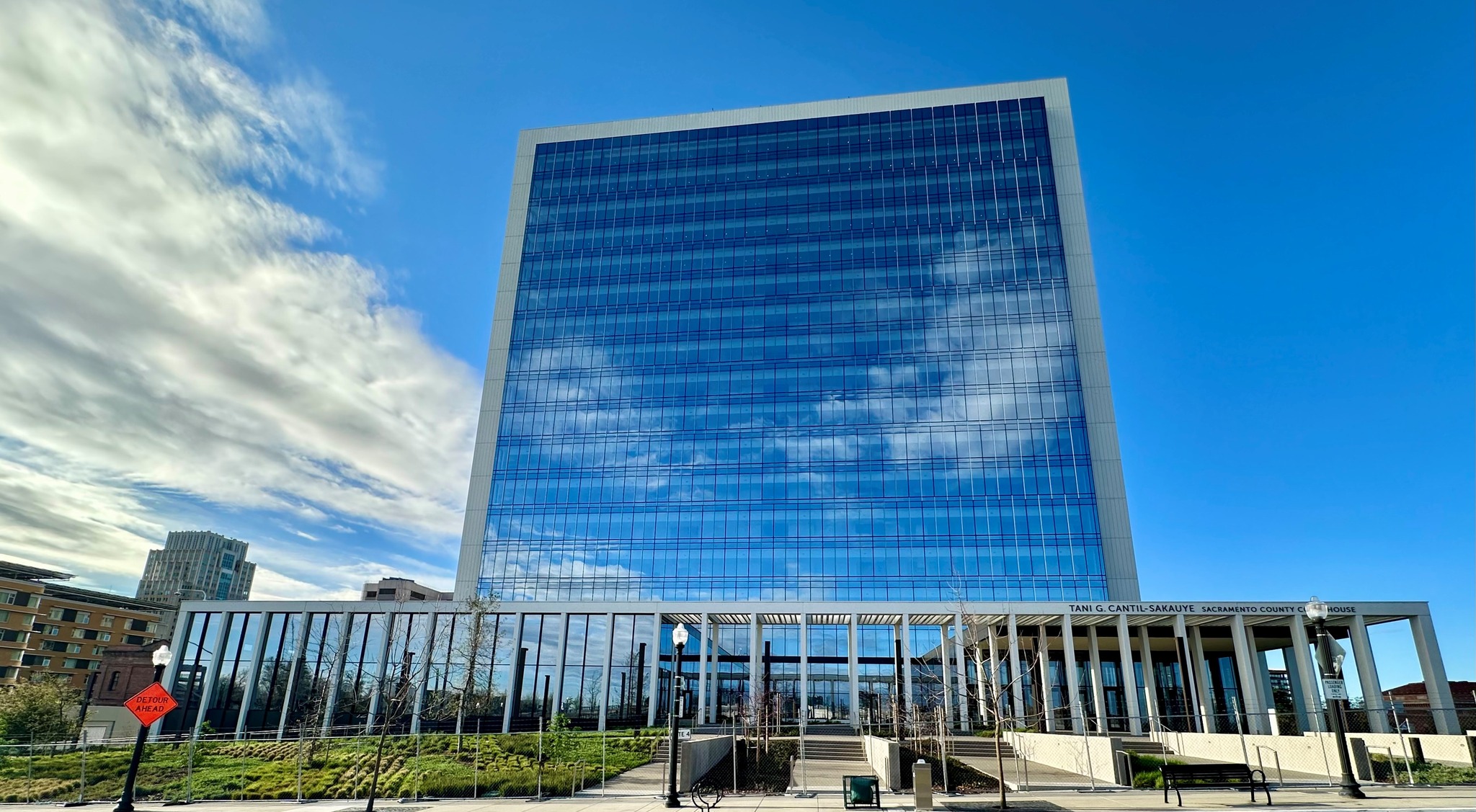 new glass high-rise Sacramento Superior Courthouse building with blue sky background
