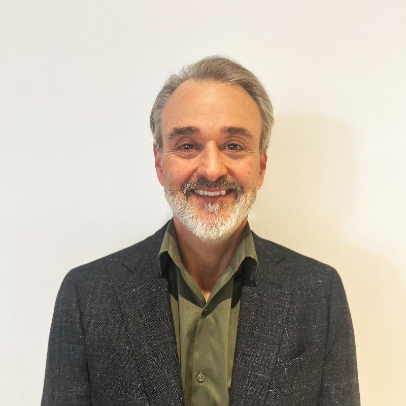 headshot photo of Guy Mallozzi wearing collared shirt and jacket