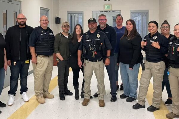 New Mexico Corrections Department Secretary Alisha Tafoya Lucero and staff