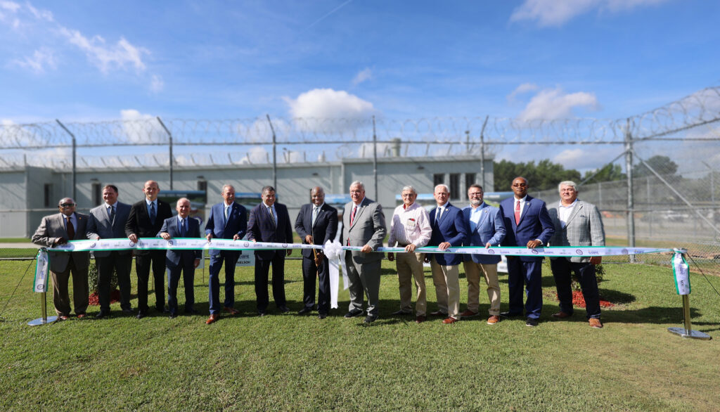 project stakeholders at ribbon-cutting ceremony at Johnson State Prison
