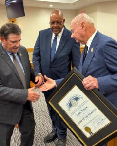 Edsel Taylor receiving award from Joel Anderson and Dennis Patterson