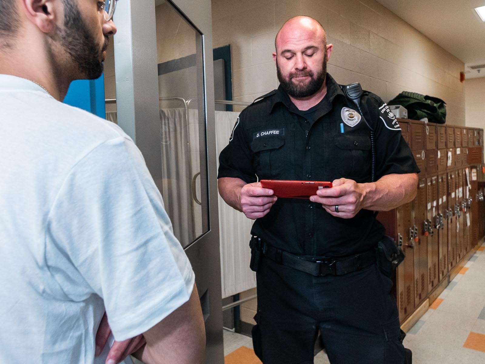 correctional officer using tablet