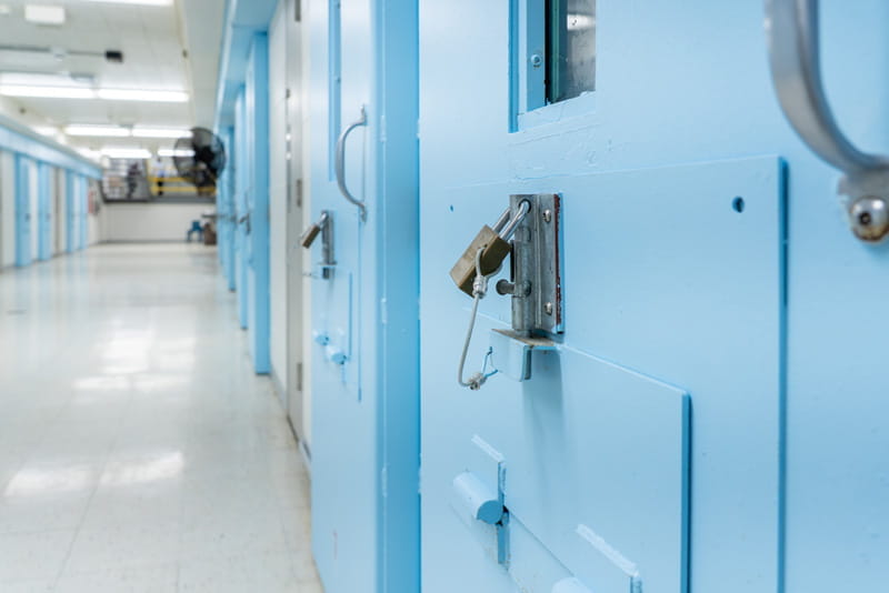 close-up of blue prison cell door at Macomb Correctional Facility