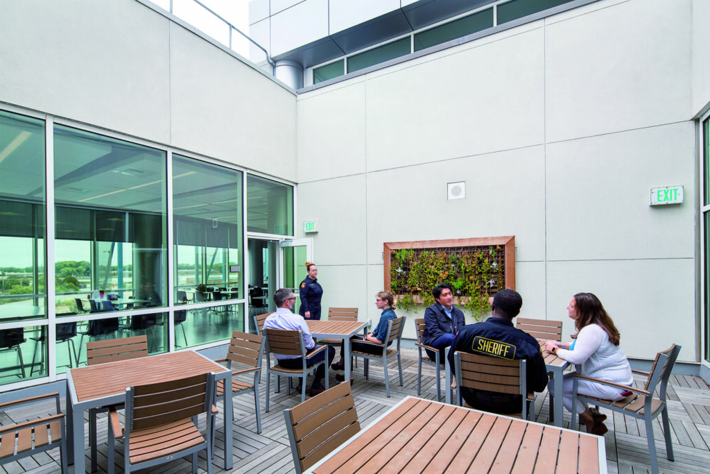 correctional staff meeting in a common area with natural light