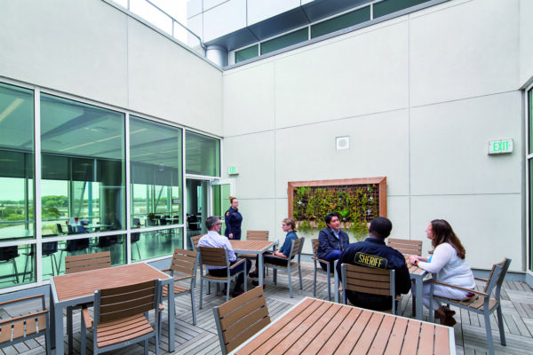 correctional staff meeting in a common area with natural light