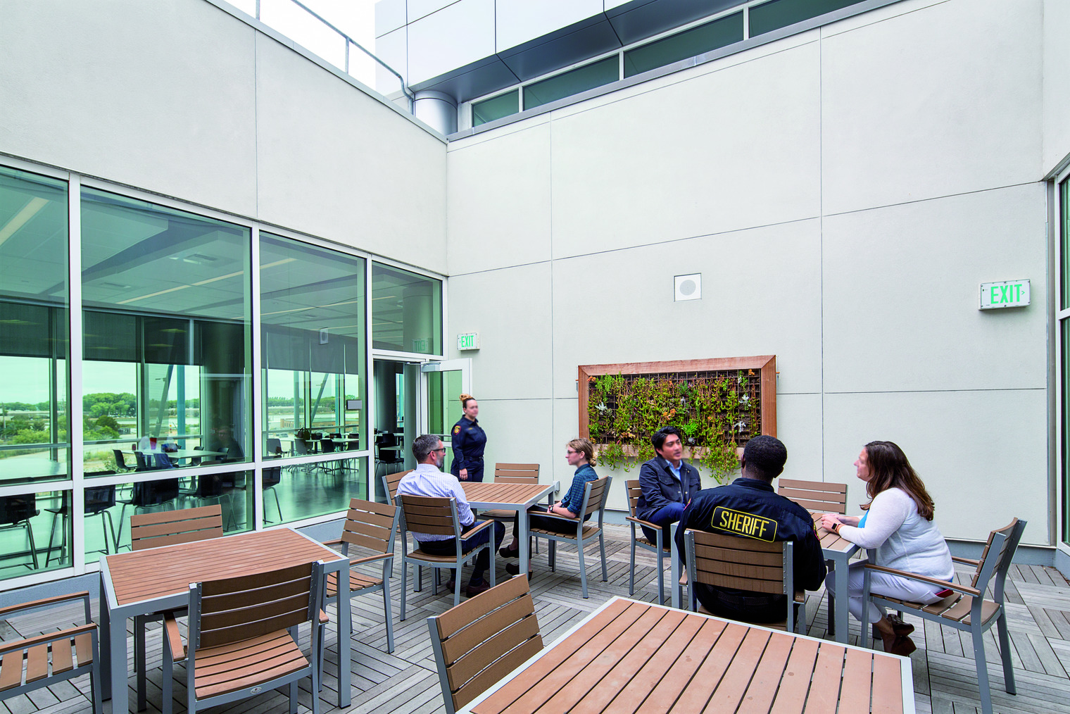 correctional staff meeting in a common area with natural light